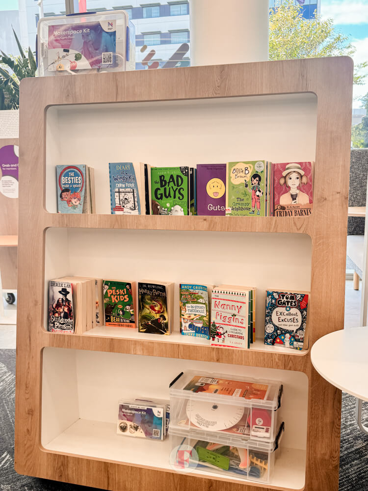 Bookshelf with children's books and maker kits