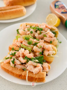 Toasted brioche rolls with generous servings of delicious prawn rolls with seafood sauce