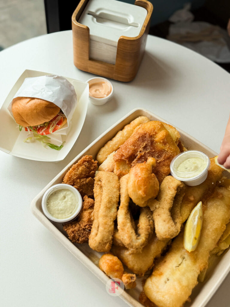 overlay shot of the seafood basket and the prawn roll